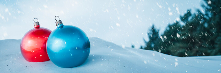 Red and blue Chiny baubles outside on a snowy day close up 3d render