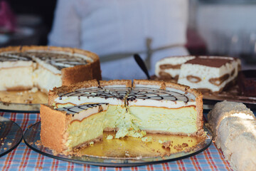 Homemade pie with fillings at the street food fair. Soft focus blurred and noise effect. Delicatessen Homemade food concept
