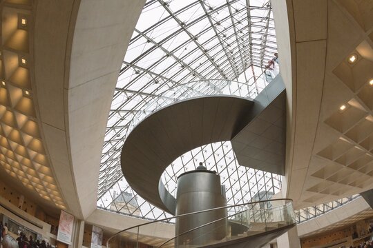 Louvre Museum, Paris, France. Glass pyramid seen from the inside. Main entrance with stairs and elevator.