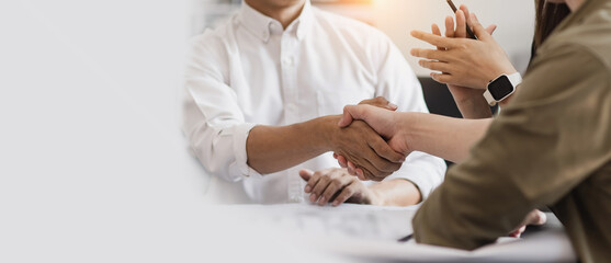 Obraz premium People hand shake in office desk, Business man shaking hands after contract signing.
