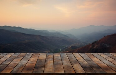 Rustic table with a stunning sunset and mountain range as backdrop