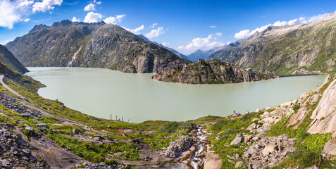 Panoramic photo of Grimselsee reservoir on the Grimsel mountain pass in Switzerland