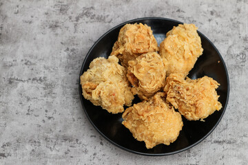 Fried tofu with spicy chiken filling. Often referred to as Tahu Mercon. Because it is deep fried, this tofu is also called Tahu Krispi. Traditional food from Indonesia which is crunchy and savory.