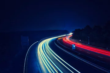Fototapeten Langzeitbelichtung - Autobahn - Strasse - Traffic - Travel - Background - Line - Ecology - Highway - Long Exposure - Motorway - Night Traffic - Light Trails - High quality photo  © Enrico Obergefäll