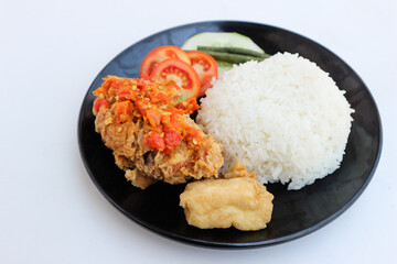 Ayam Geprek Indonesian Food crispy fried chicken with hot and spicy sambal Chili Sauce Served Steam...