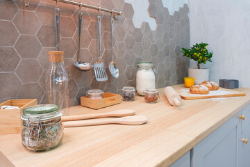 Modern kitchen interior with products on counter, Kitchen table with ingredients for cooking baking with blank place for your product