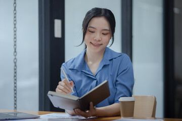 Happy young woman sitting at desk, Woman student online with laptop, Distant education concept.   
