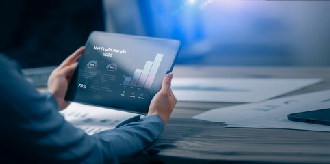 Technology and financial advisory services concept. Business woman hands working on digital tablet computer with advisor showing plan of investment to clients at table office. Digital marketing.