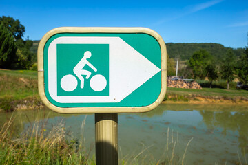 A sign of a cycle track along Canal of Burgundy, France