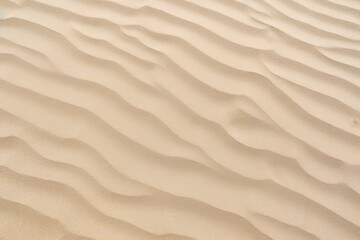 Fototapeta na wymiar Closeup of sand pattern of a beach in the summer.