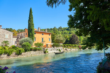 Fototapeta na wymiar Beautiful panoramic view of the mill village of Borghetto in the south of Lake Garda, province of Verona, Italy.