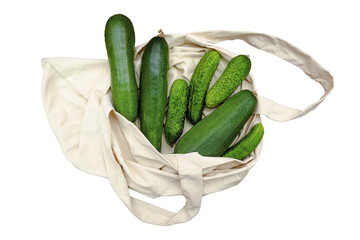 Detox diet fitness vegetarian vegan healthy food for dinner,proper nutrition with fresh cucumbers vegetables in eco bag on wooden background top view flatly flat lay.Set of autumn harvest