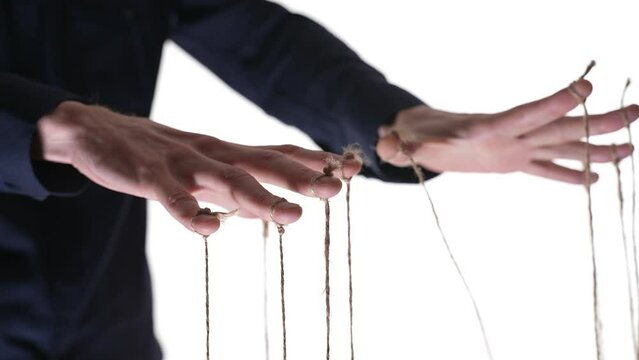 Manipulator hands with ropes on fingers. White background