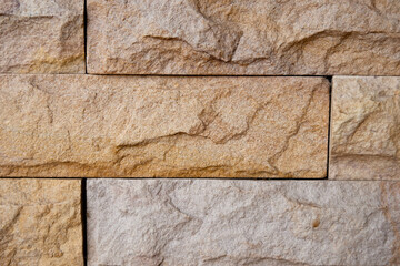Cement pillars using stone tiles Oranges arranged in a grid Can be used as a background.