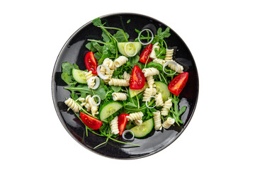 pasta salad fusilli pasta, cucumber, tomato, green lettuce, onion eating cooking meal food snack on the table copy space food background rustic top view