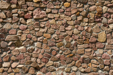 Background of an old wall made of red stone.