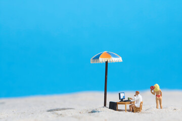 home office on a beach, miniature figures scene
