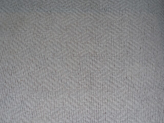 Background texture of woven fabric. Close-up of the surface of intertwined threads