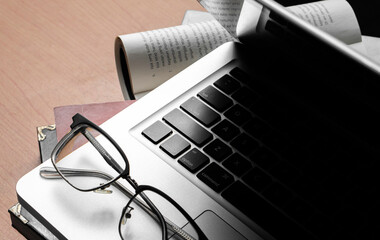 Creative Creativity Web Design desk with books, laptop and glasses on wooden background