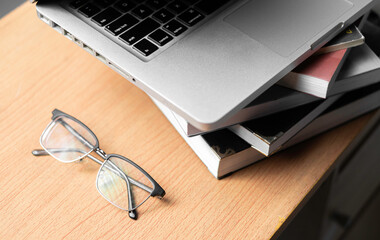 Creative Creativity Web Design desk with books, laptop and glasses on wooden background