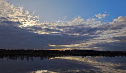 Sunset on the river in the clouds