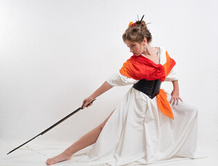 Japanese style ninja girl in traditional Japanese clothing with a black sword on a white background.