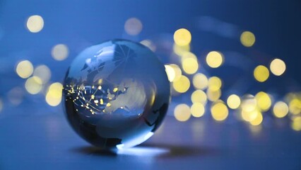 Worldwide trade 2025 blue business glass globe with europe, eu and asia continent rolling in front of golden bokeh lights. - Powered by Adobe