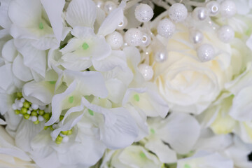 Obraz na płótnie Canvas Wedding background of white flowers. Close-up, selective focus