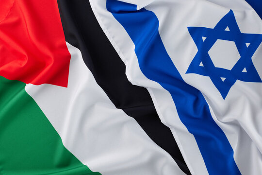 The Concept of the Israel-Palestinian authority Conflict. Top view flat lay of Palestinian flag and Israeli flag - Powered by Adobe