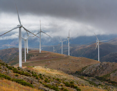 wind generators on a cloudy ridge