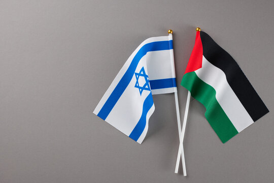 Israel-Palestine dispute. Top view photo of Palestinian flag, Israeli flag on grey background with empty space for special message