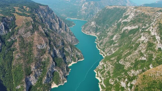 Aerial view of Beautiful Piva river canyon with reservoir Piva Lake (Pivsko Jezero) summer view in Montenegro. Nature travel background, 4k 