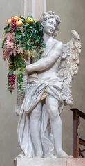 Foto op Plexiglas FORLÍ, ITALY - NOVEMBER 11, 2021: The baroque statue of angel with the flowers on the main altar in the church Chiesa di Santa Lucia. © Renáta Sedmáková