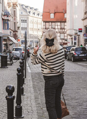 Vacation in France. Traveling and adventure concept. Beautiful European Blonde Woman at town, tourism concept scene