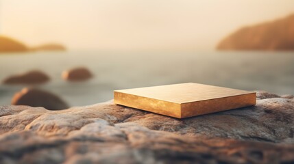 Square Stone Podium in gold Colors in front of a blurred Seascape. Luxury Backdrop for Product Presentation