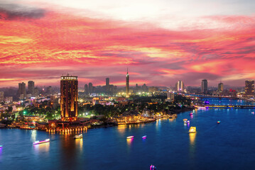 Fototapeta na wymiar Incredible sunset over the Nile and night center of Cairo, Egypt
