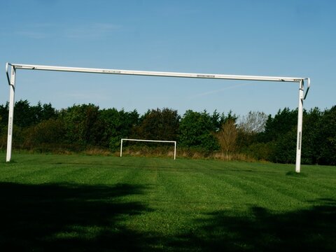 Goal post in field in the distance 