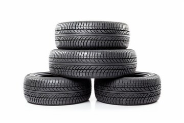 Stacked car tires of different sizes. Isolated on white background. Concept of repair, maintenance...