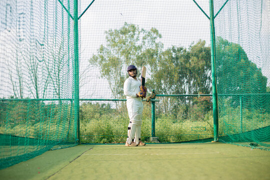 Cricket Batsman waiting bowler to bowl. Player ready to do more practice in nets