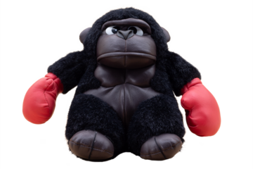 Stuffed gorilla boxer with angry face and red boxing gloves on a transparent background. Boxing and fighting concept