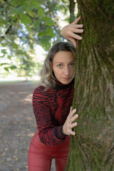 Outdoor shooting, blonde woman with autumn clothes. Blue eyes