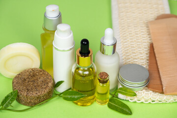 Natural cosmetics for face and body skin care, hair. Plastic-free, eco-friendly packaging. On a green background