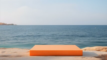 Square Stone Podium in orange Colors in front of a blurred Seascape. Luxury Backdrop for Product Presentation