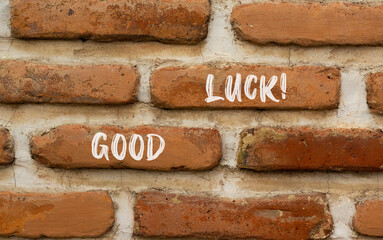 Good luck symbol. Concept words Good luck on beautiful brown bricks. Beautiful brick wall background. Beautiful brick wall. Business, motivational good luck concept. Copy space.