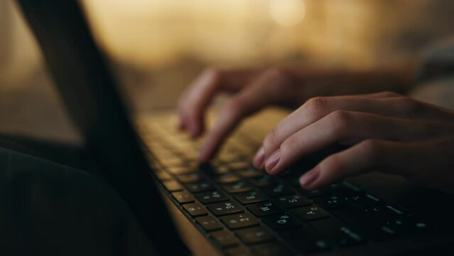 Hands typing keyboard night closeup. Late manager freelancer working computer