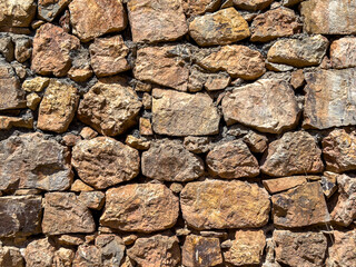 Old stone wall background. Ancient stonewall texture