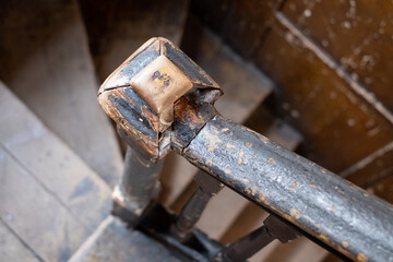 Detailed photo of old wooden stairs and bannisters in stairwell at shabby dilapidated traditional Georgian Huguenot townhouse, Princelet Street, Spitalfields, East London, UK. 