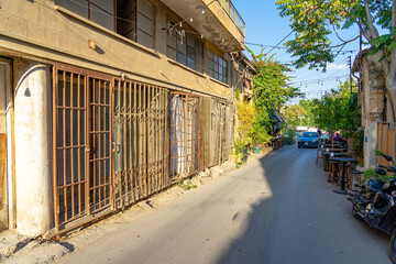 one of the streets in Lefkosia, capital of Northern Cyprus next to the border with Nicosia, Republic of Cyprus in a state of abandonment and degradation