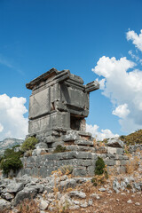 Ancient old ruined tombs against cloudy sky in Turkey