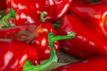background of red bell pepper with green tail